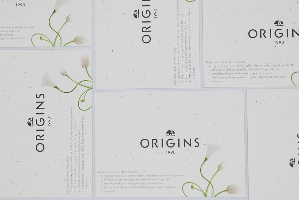 Cabecera una tarjeta plantable en papel con semillas contra la deforestación. marca Origins